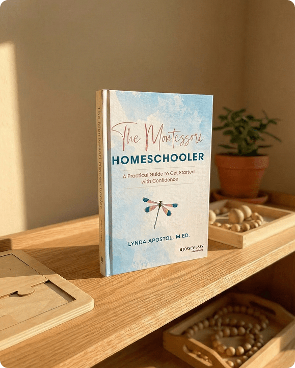 The Montessori Homeschooler Book on table