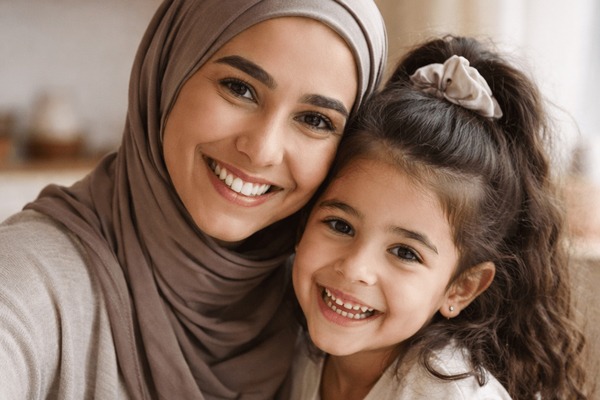 Montessori parent and child smiling together at home